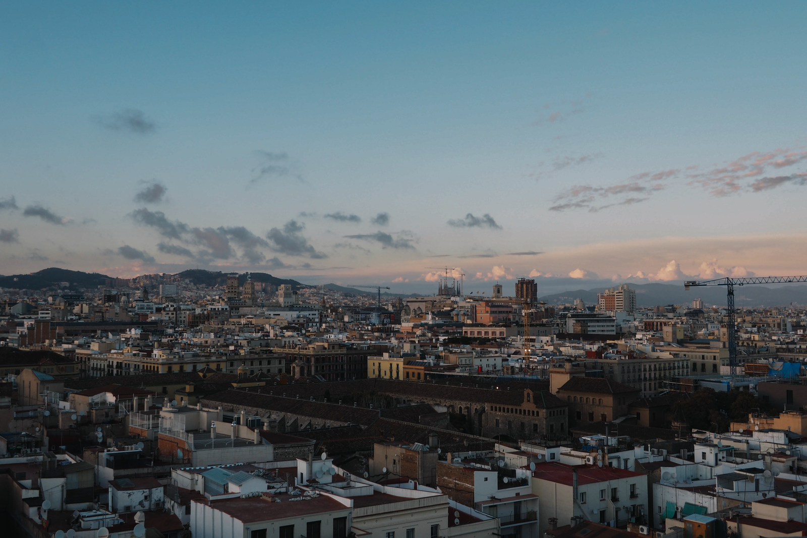 Aerial view of Barcelona skyline at sunset with Sagrada Família