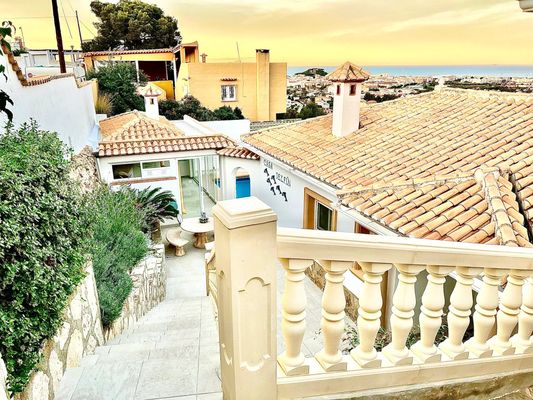 Casa Delfin terrace stairs overlooking the sea at sunset